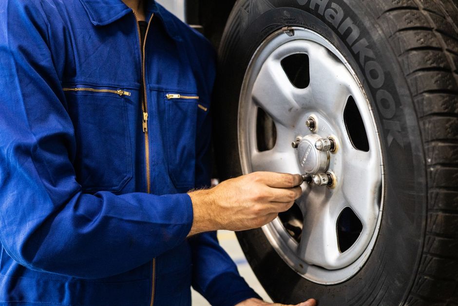 Professional mechanic performing tire installation