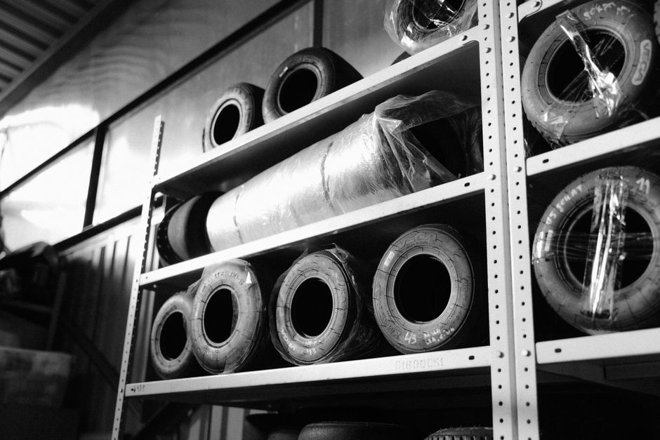 Secure tire storage facility with tires on racks